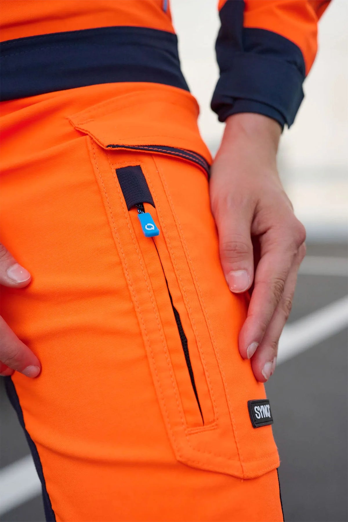 SYNQ Beaqon Women in High-vis orange/Navy blue, lifestyle photo