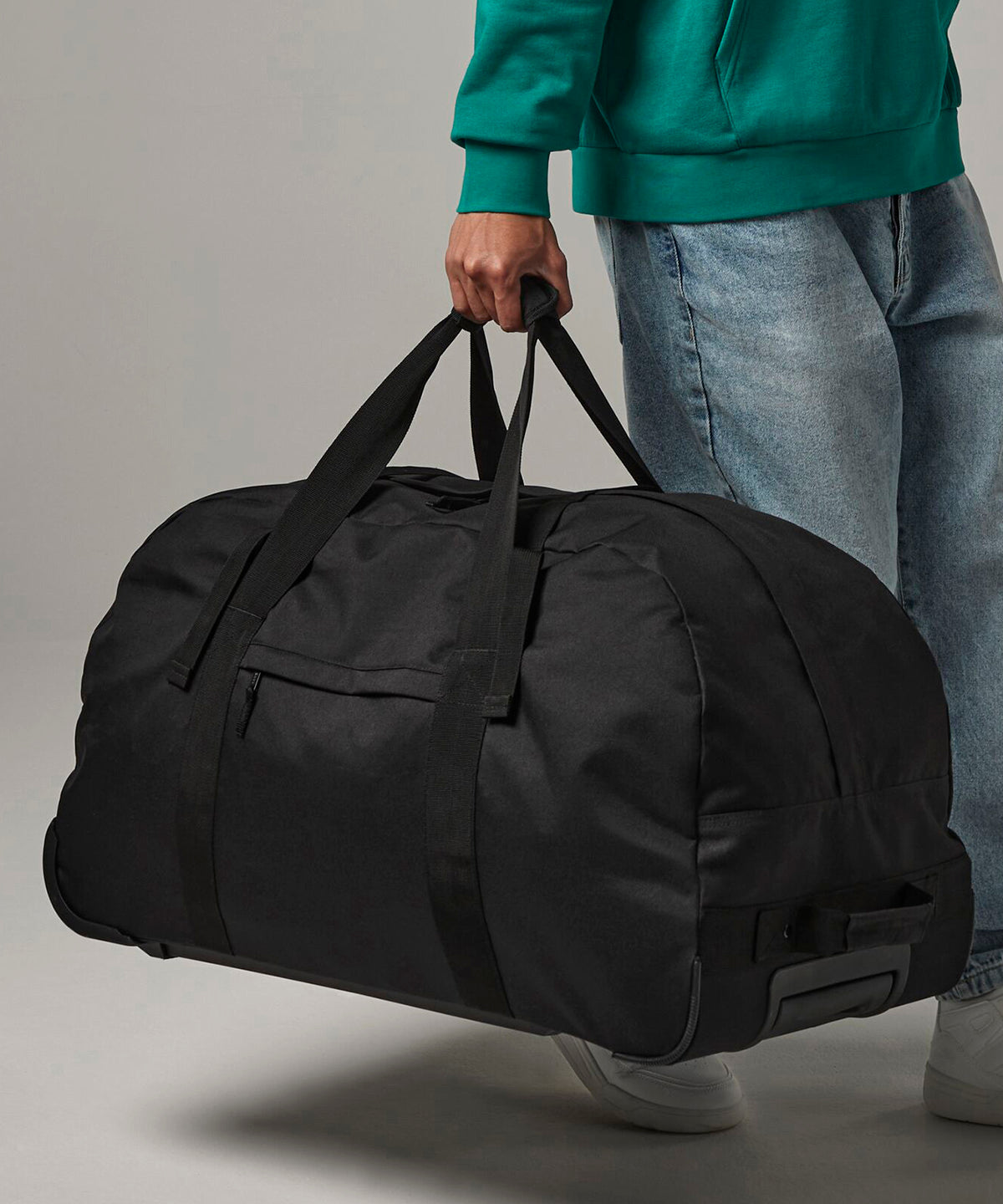Bagbase Classic wheelie holdall in Black, lifestyle photo