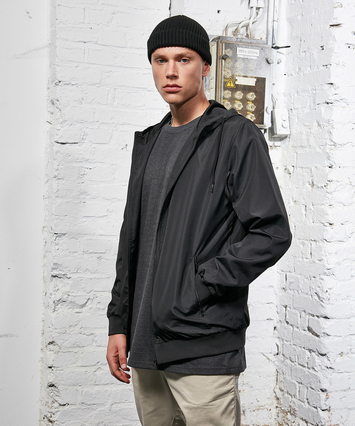 Build Your Brand Recycled windrunner in Black/Black, lifestyle photo