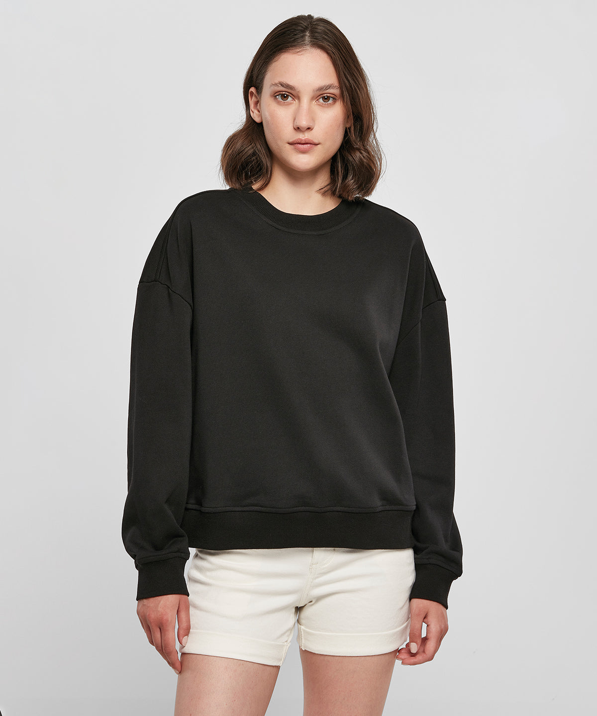 Build Your Brand Women’s oversized crew neck sweatshirt, lifestyle photo