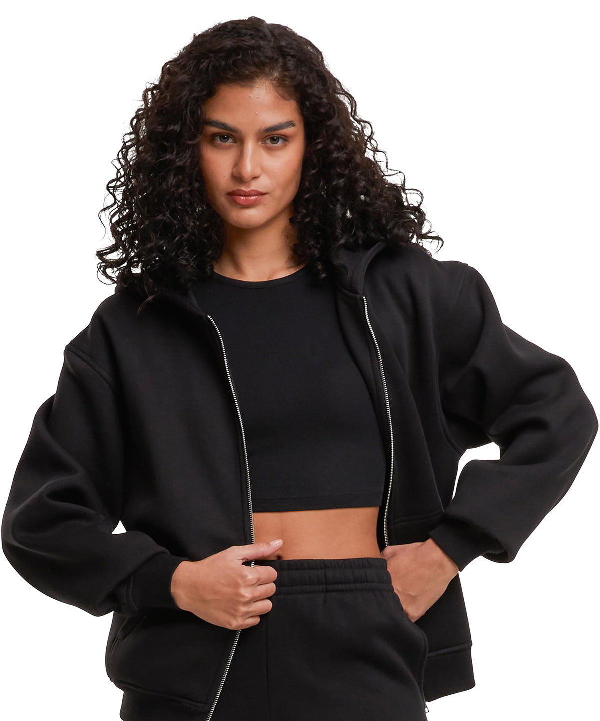 Build Your Brand Women’s loose-fit zip hoodie, lifestyle photo