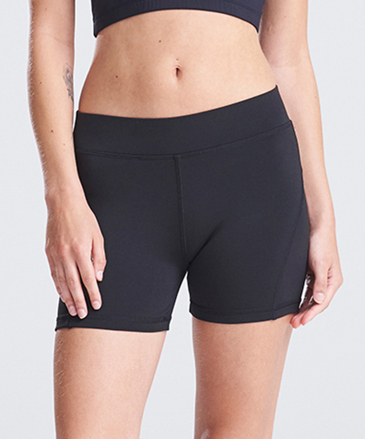AWDis Just Cool Women's cool training shorts in Jet Black, lifestyle photo