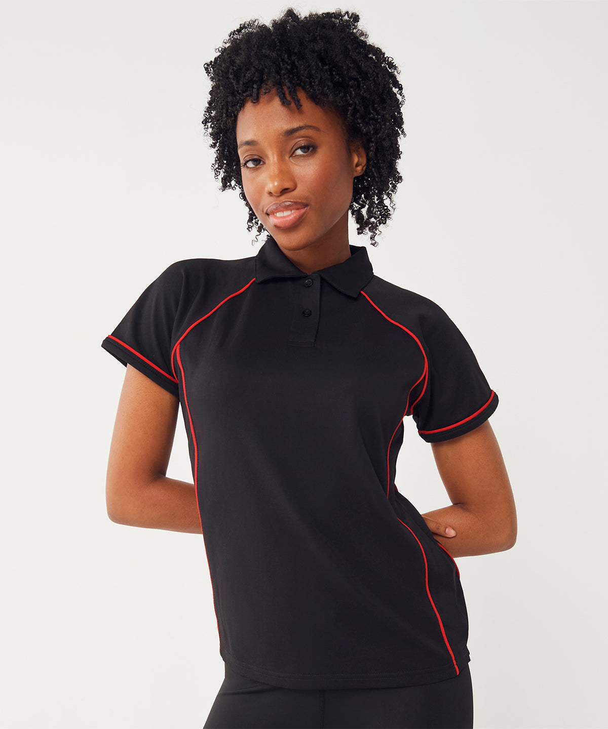 Finden & Hales Women's piped performance polo, lifestyle photo