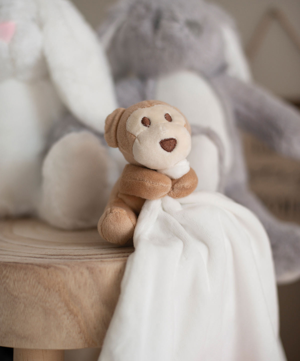 Mumbles Monkey comforter in Cream, lifestyle photo