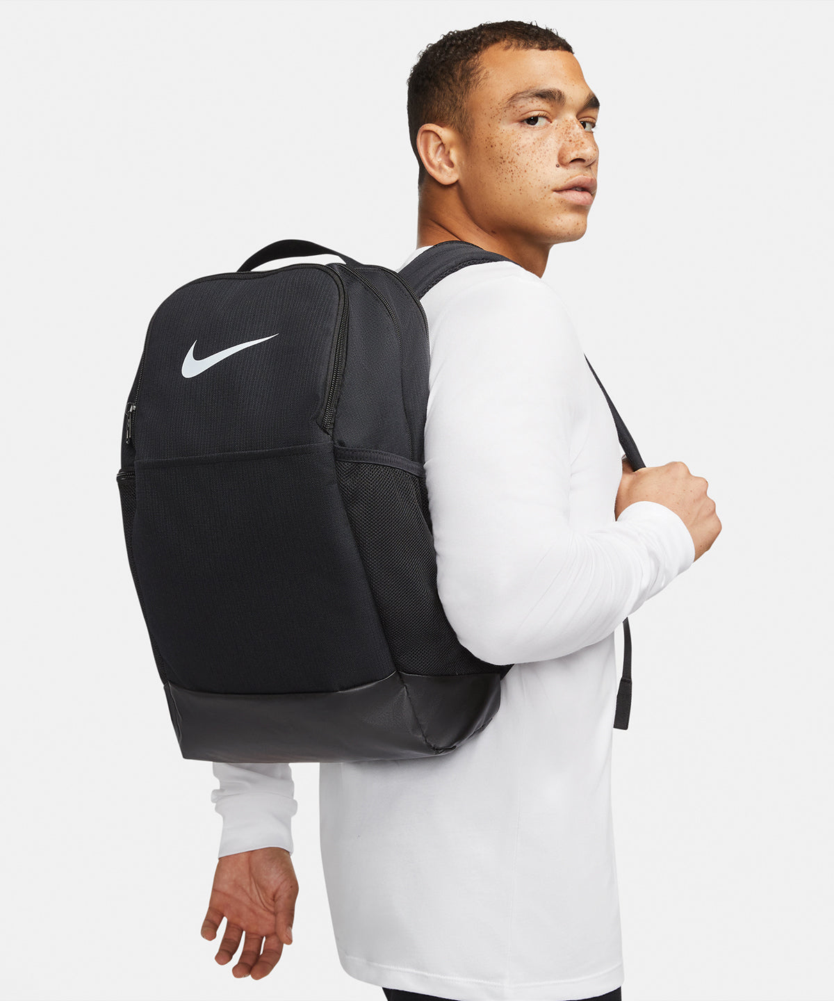 Nike Brasilia backpack (24 litre) in Black/Black/White, lifestyle photo