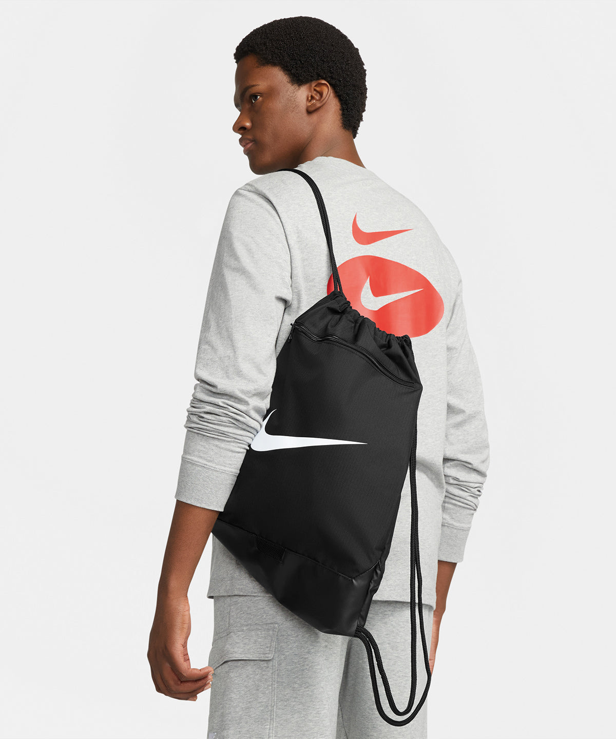 Nike Brasilia drawstring (18 litre) in Black/Black/White, lifestyle photo