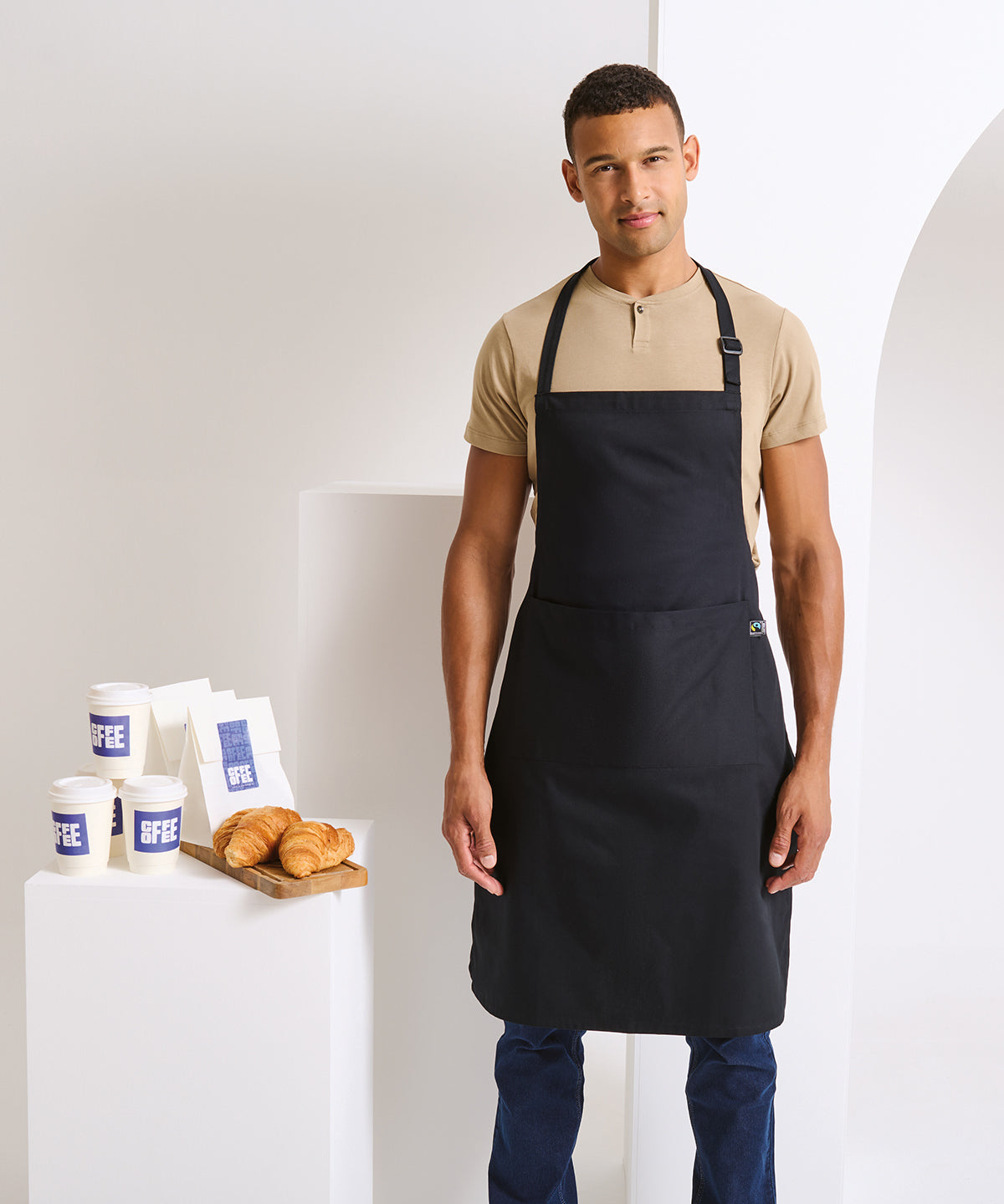 Premier Cotton bib apron, organic and Fairtrade certified in Black, lifestyle photo