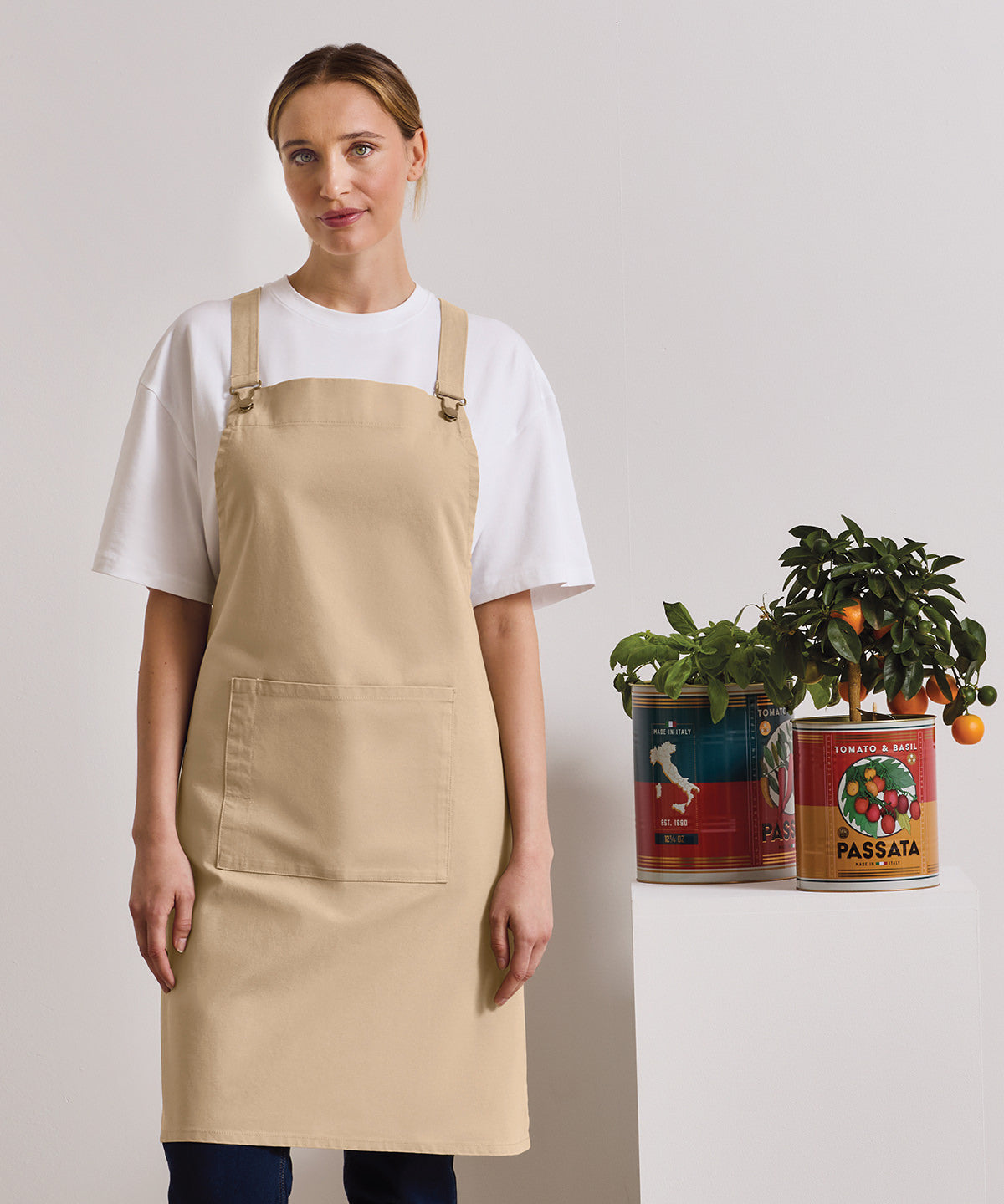 Premier Cross back 'barista' bib apron, lifestyle photo