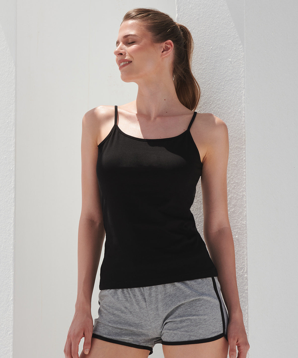 SF Women's feel-good stretch spaghetti vest in Black, lifestyle photo