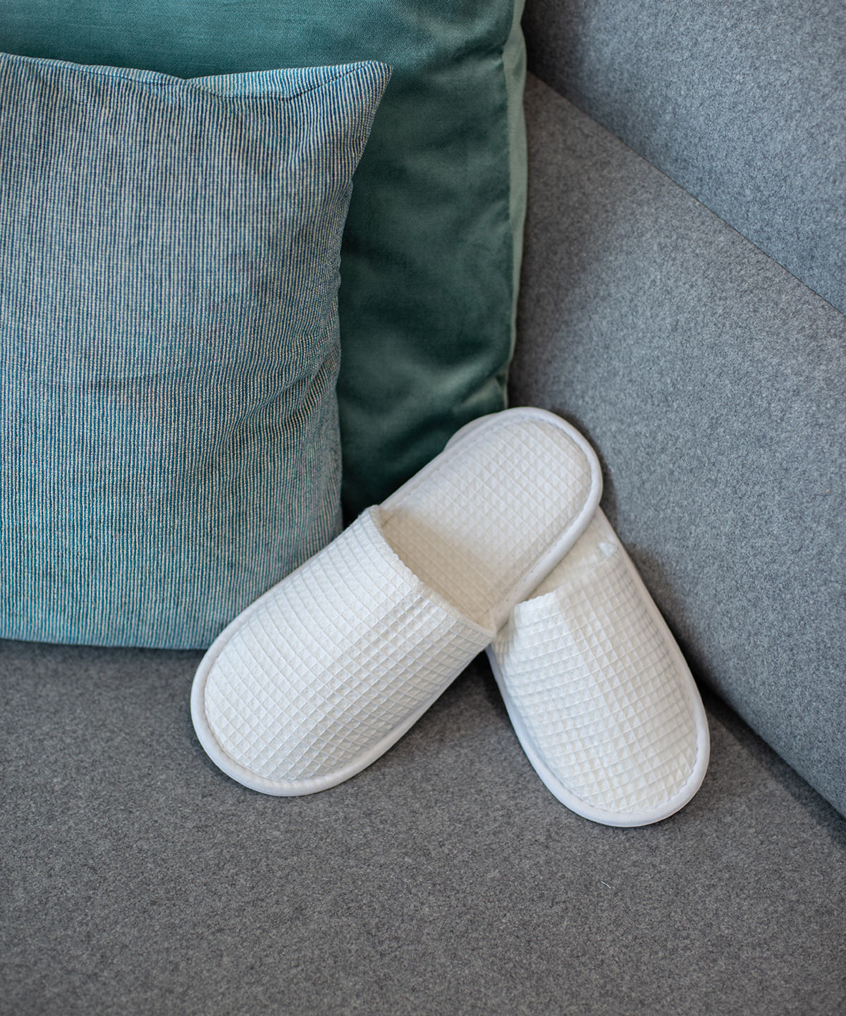 Towel City Waffle mule slippers in White, lifestyle photo