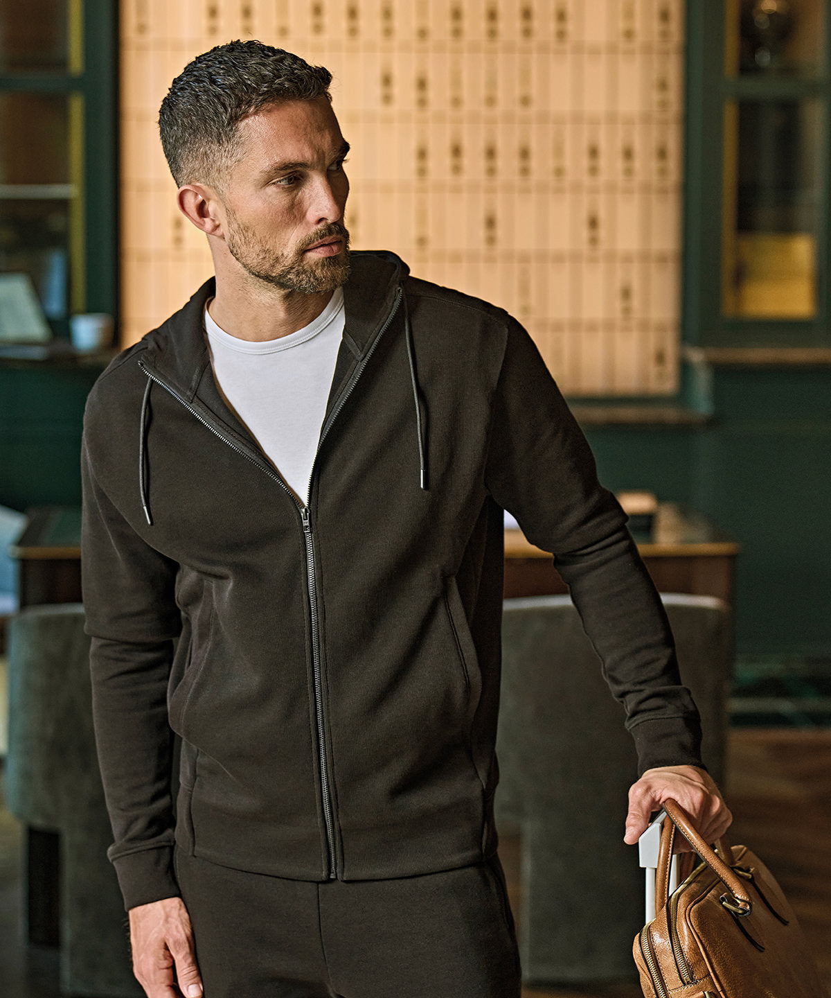 Tee Jays Ribbed interlock hooded full-zip in Black, lifestyle photo