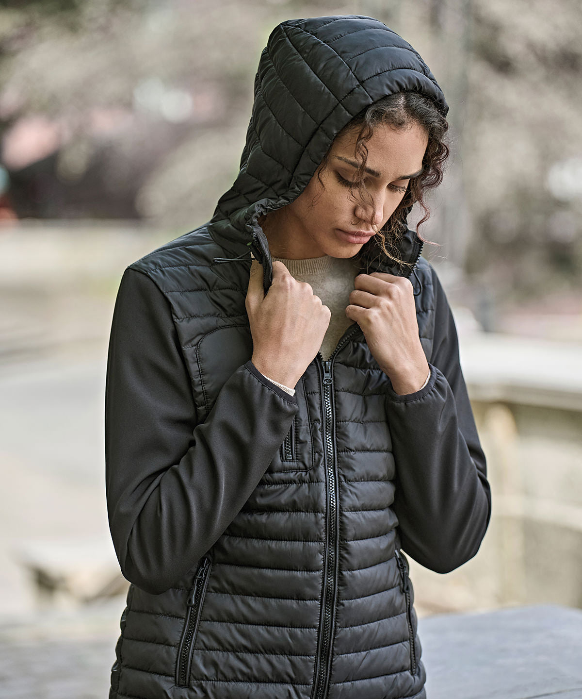 Tee Jays Women’s hooded crossover jacket in Black/Black, lifestyle photo