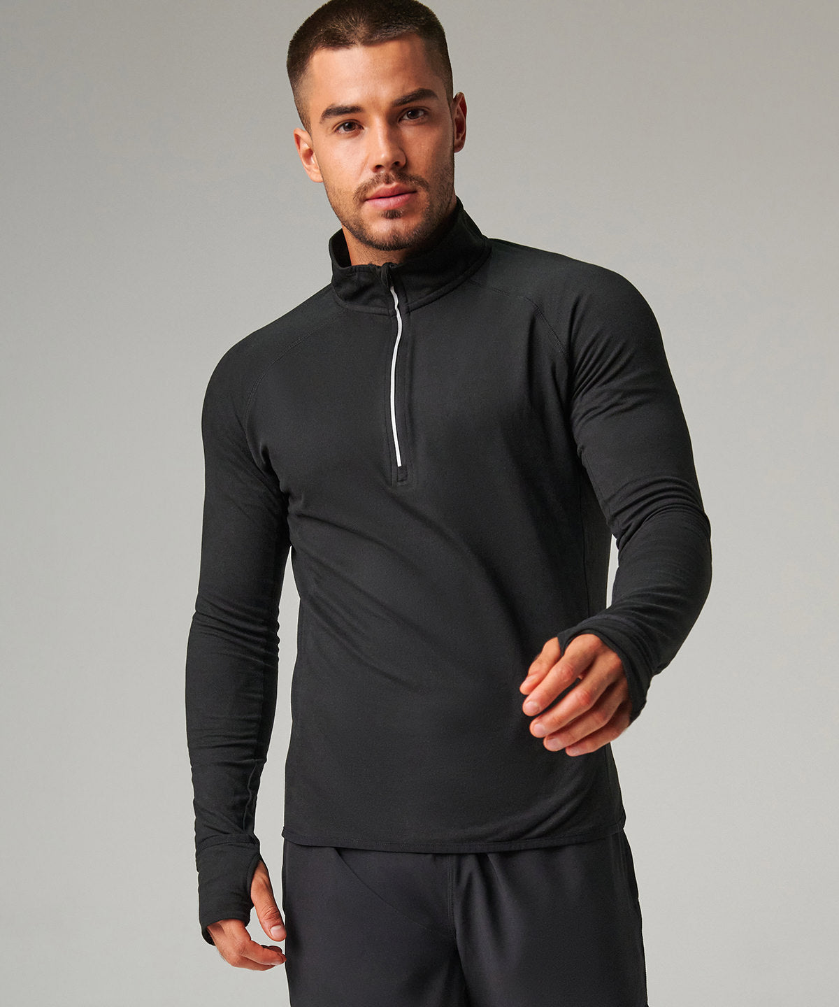 Tombo Long-sleeved ¼ zip top in Black, lifestyle photo