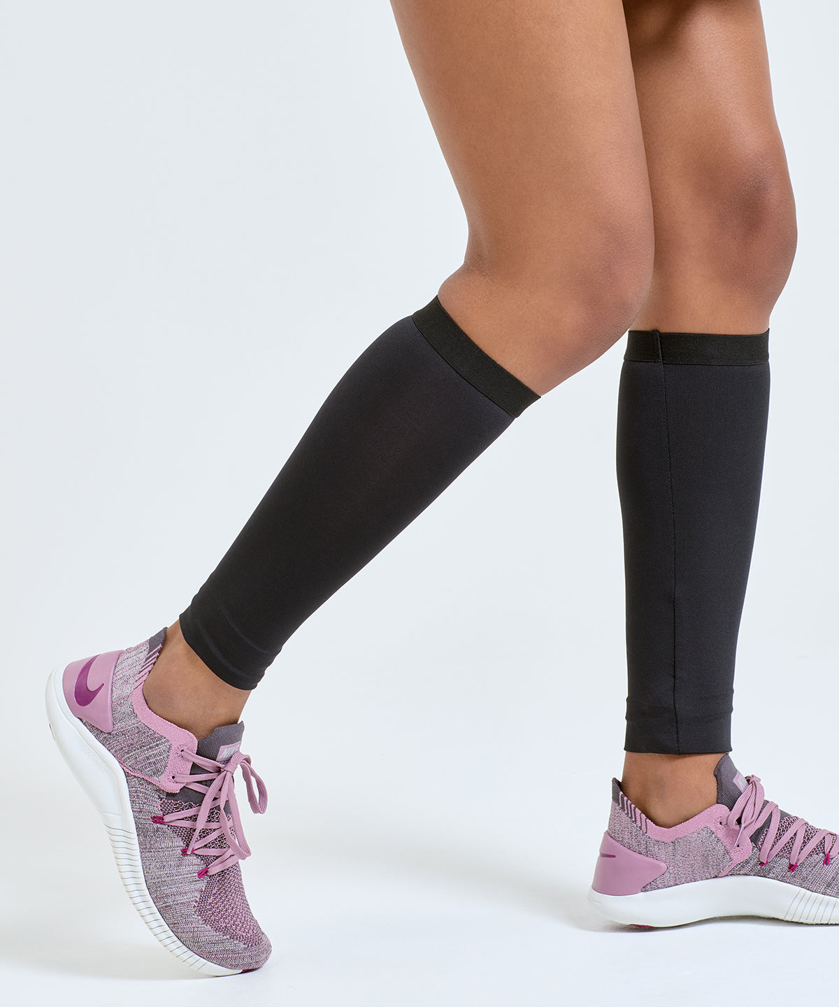 TriDri Compression calf sleeves in Black, lifestyle photo