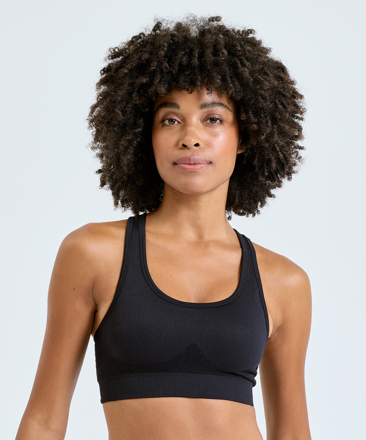 TriDri Seamless 3D fit" multi-sport sculpt solid colour bra", lifestyle photo