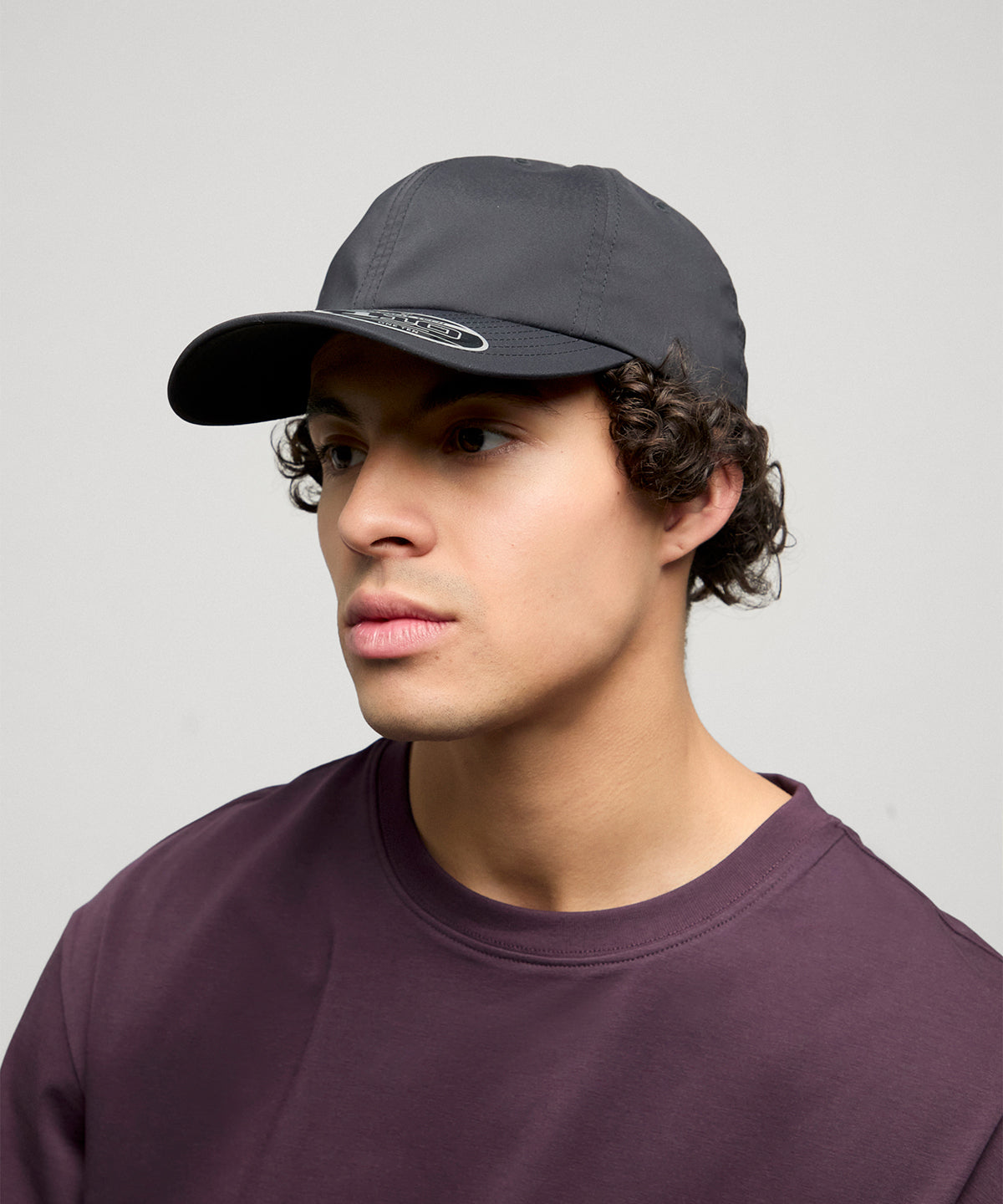 Flexfit by Yupoong 110 Performance cap in Black, lifestyle photo