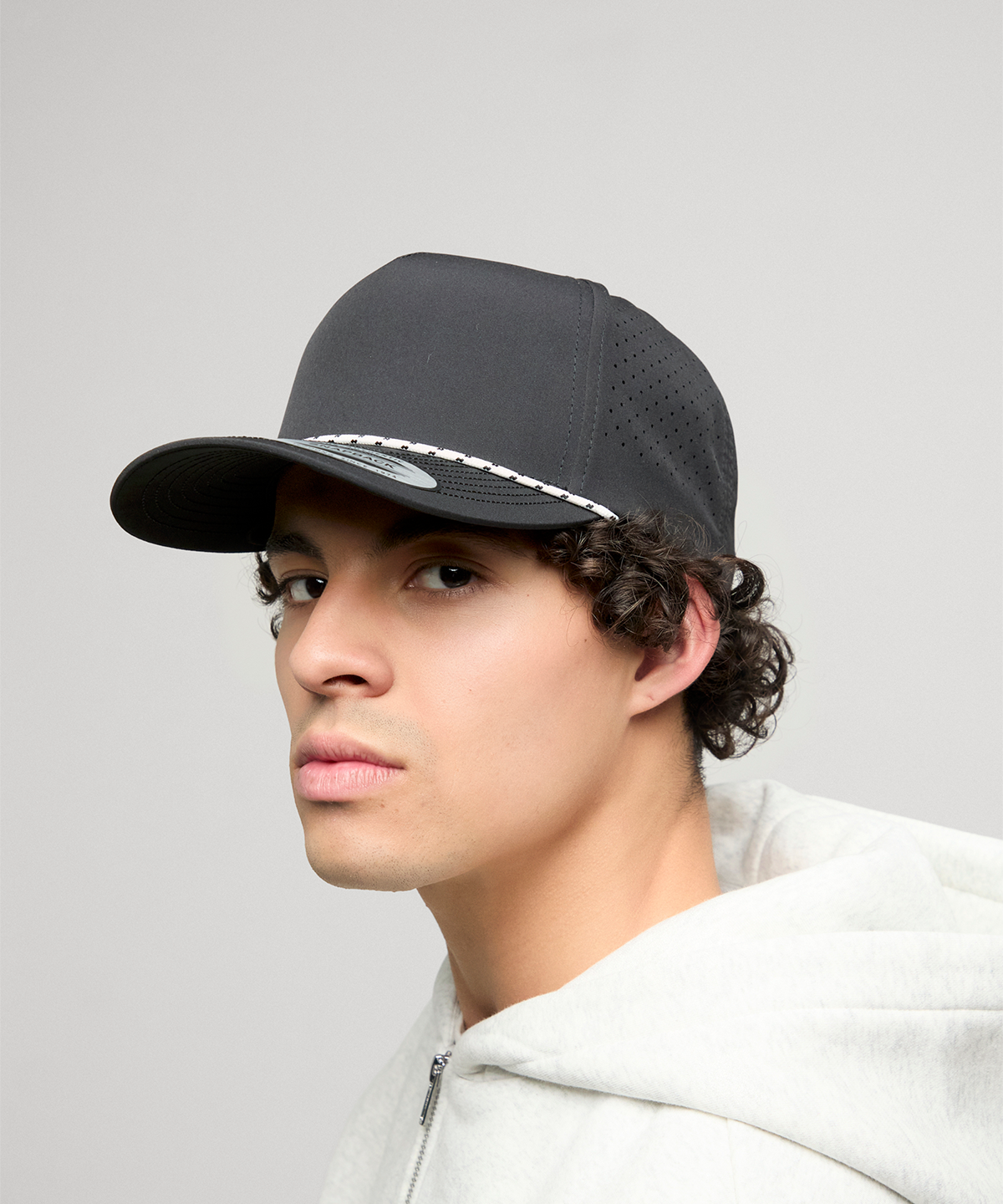 Flexfit by Yupoong YP Classics 5-panel snapback cap with perforations and braided rope, lifestyle photo