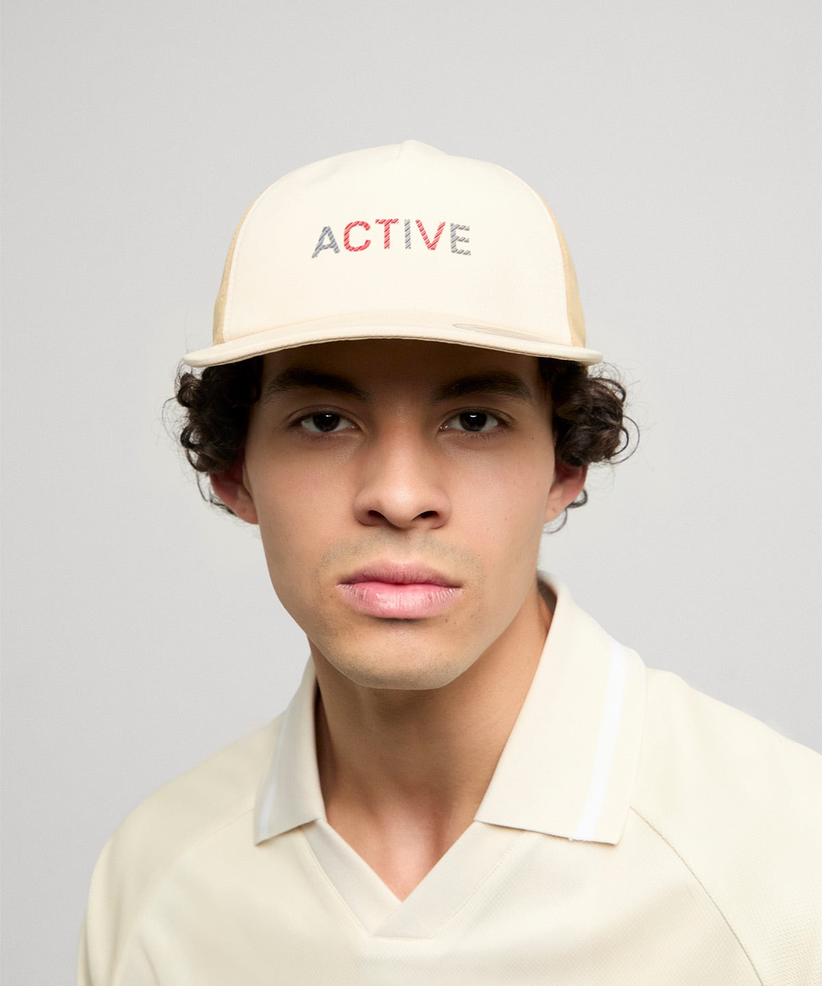 Flexfit by Yupoong YP Classics unstructured mesh active cap in Beige/Caramel, lifestyle photo