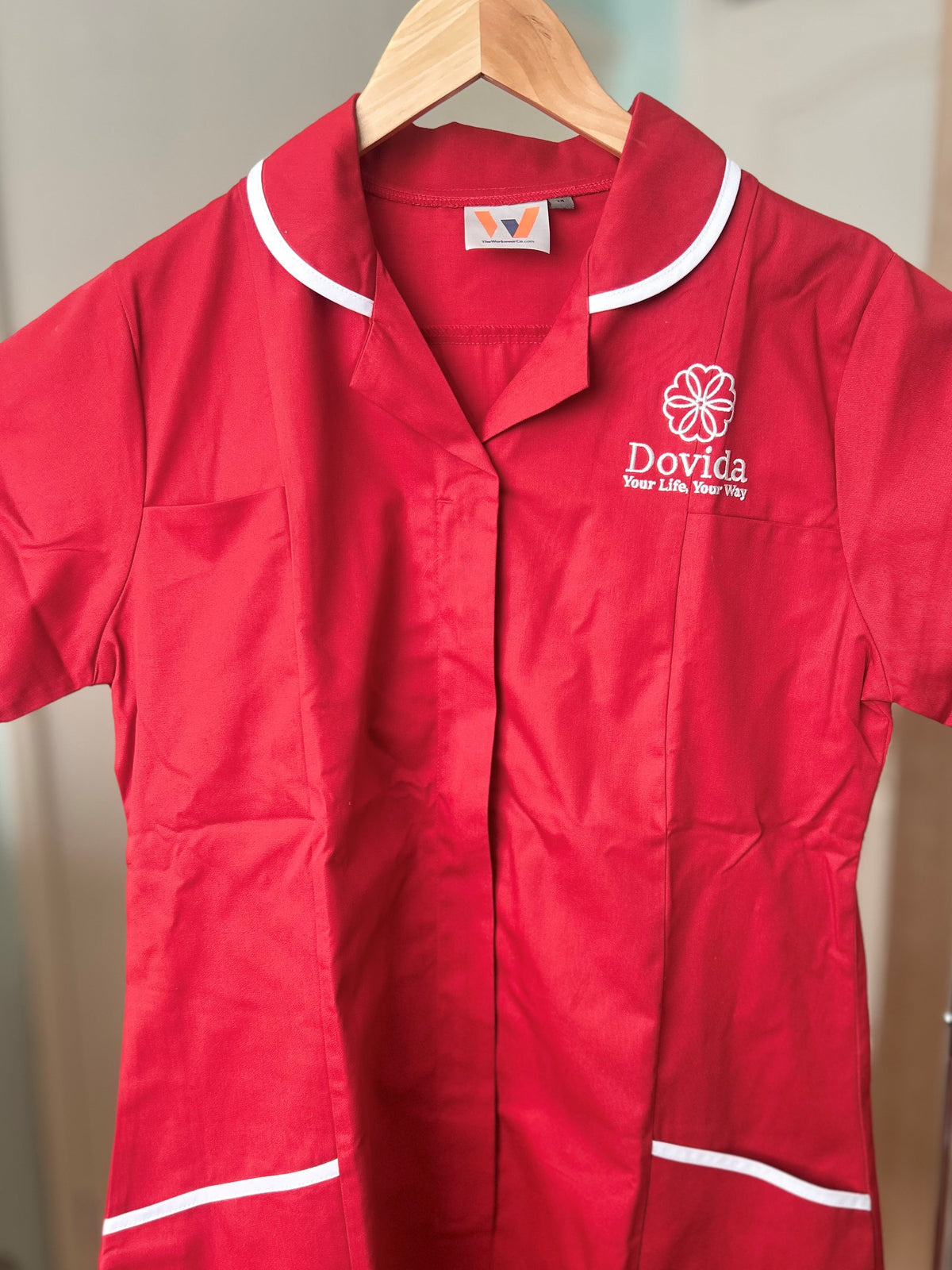 Behrens Female tunic with Dovida logo, main product image