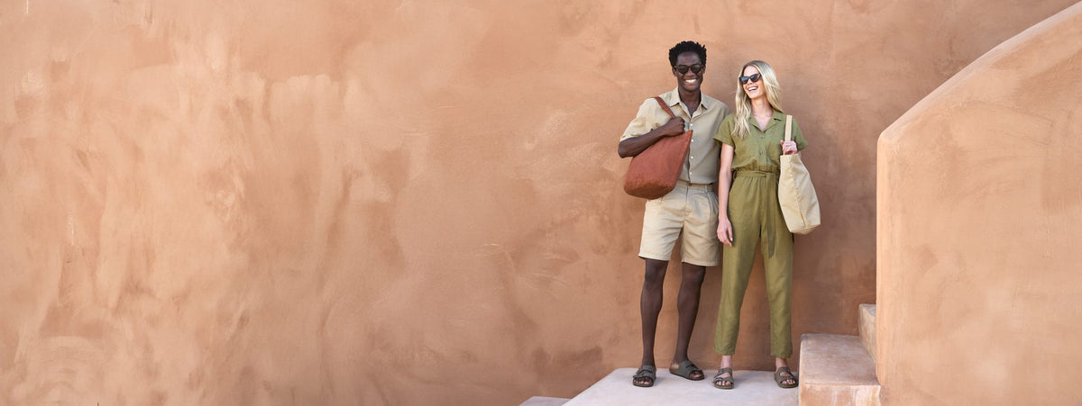 Two people carrying Westford Mill garment dyed shopper and tote bags